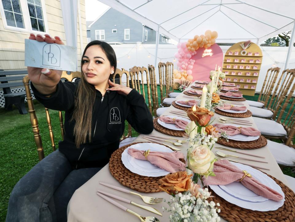 Cynthia Viruet, owner of Jociah Party Decor, at a house party on North Main Street in Brockton on Saturday, April 20, 2024.