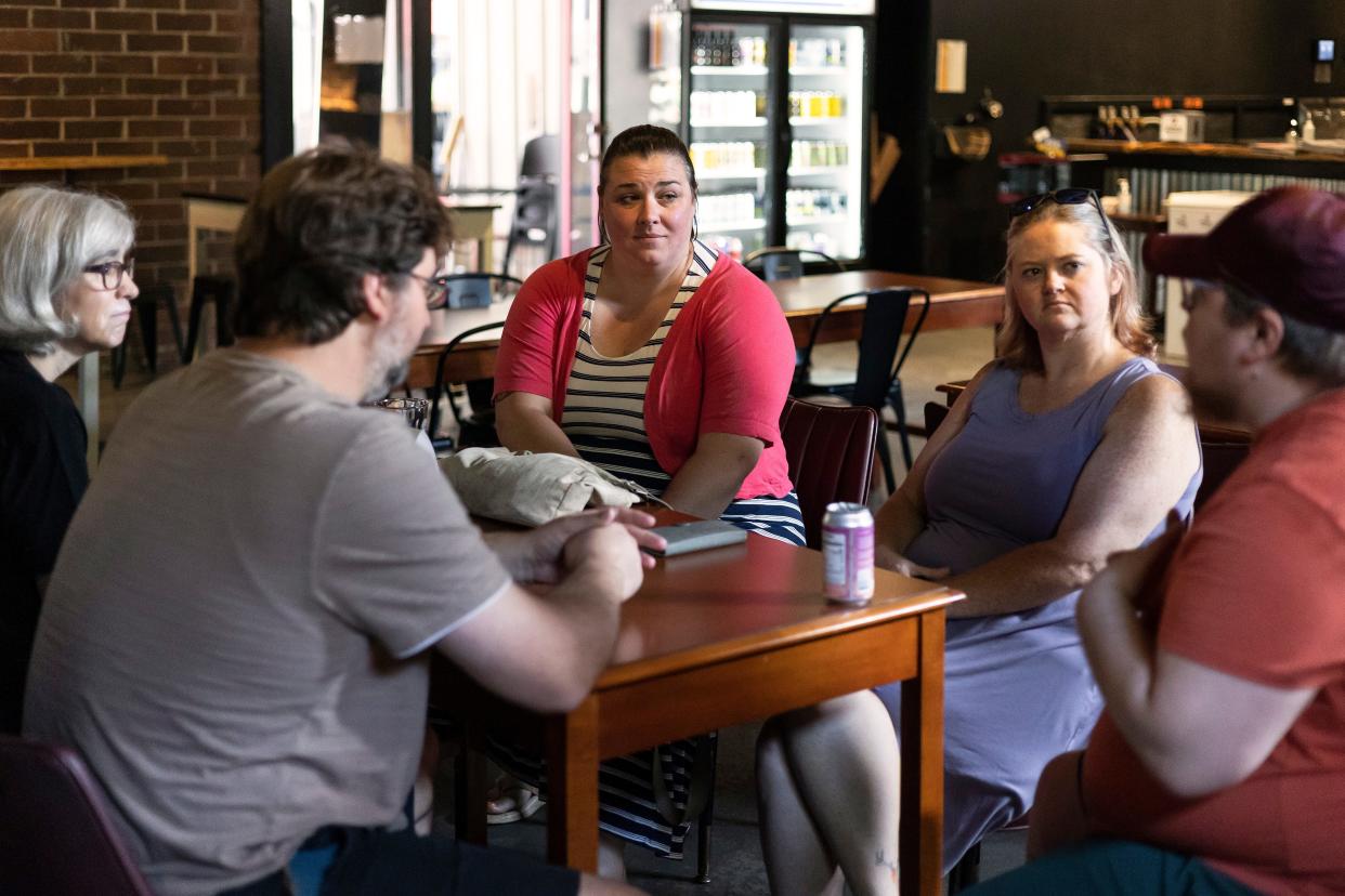 The Rev. Laura Patterson of Oconee Street United Methodist Church, center, listens to peoples’ perspectives on homelessness in Athens during their bi-weekly Not Church meetings on Thursday, July 14, 2022.