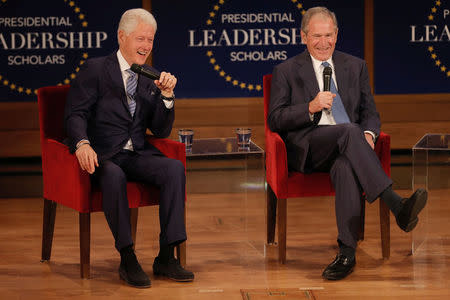 Former U.S. Presidents Bill Clinton (L) and George W. Bush participate in a moderated conversation at the graduation class of the Presidential Leadership Scholars program at the George W. Bush Presidential Library in Dallas, Texas, U.S., July 13, 2017. REUTERS/Brandon Wade