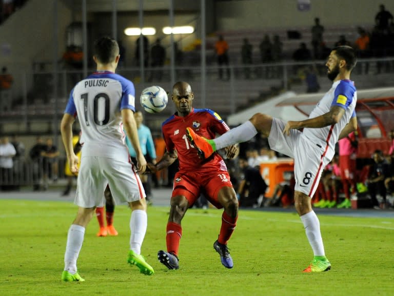 Clint Dempsey (R) and Christian Pulisic of the US fight for the ball with Panama's Adolfo Machado during their Russia 2018 World Cup qualifier match, in Panama City, on March 28, 2017