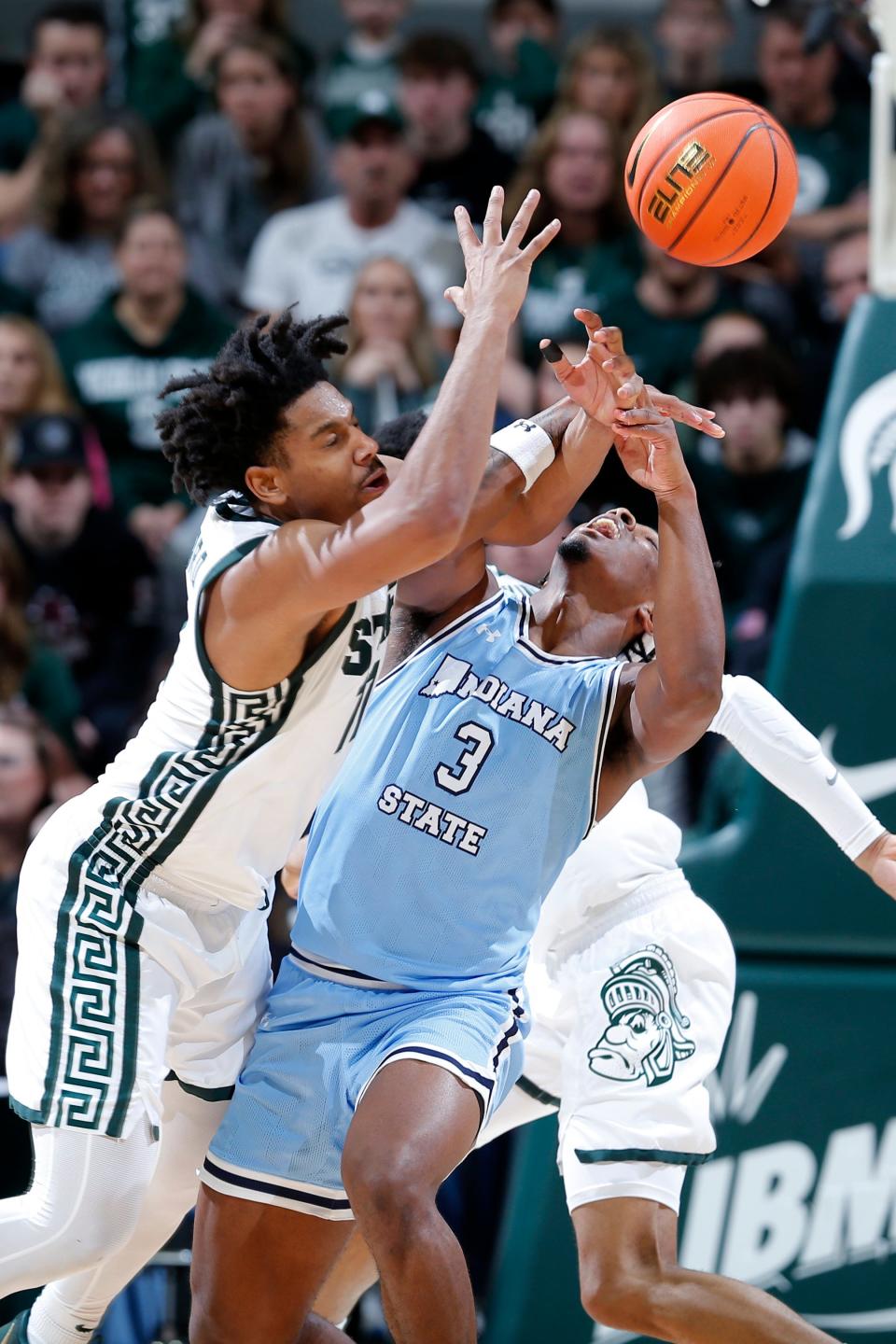 Indiana State guard Ryan Conwell (3) and Michigan State guard A.J. Hoggard, lefrt, battle for the ball during the second half at Breslin Center in East Lansing on Saturday, Dec. 30, 2023.