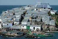 The densely populated island of Migingo in Lake Victoria is covered with corrugated-iron shacks
