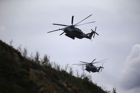 Helicopters fly during a NATO military exercise at Raposa beach, near Setubal, Portugal October 20, 2015. REUTERS/Rafael Marchante