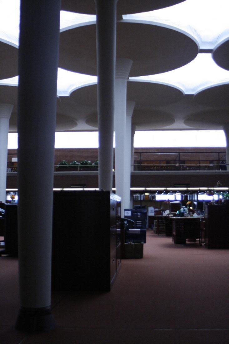 This Friday, April 18, 2014, photo shows the great room in the SC Johnson Administration Building in Racine, Wis. Architect Frank Lloyd Wright used the lily pad-like pillars to support the structure, allowing him to create exterior walls of glass that provide a lot of natural light. (AP Photo/M.L. Johnson)