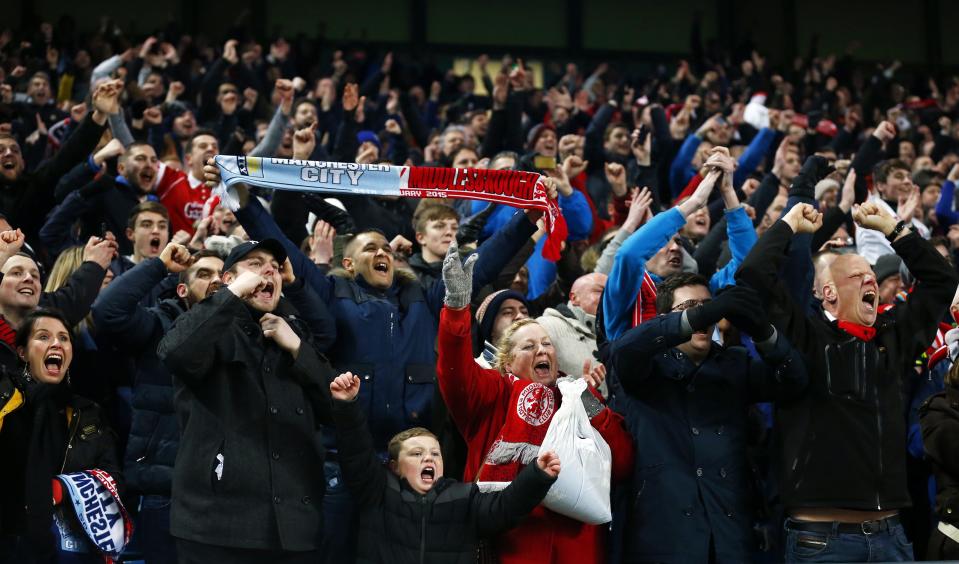 Middlesbrough fans celebrate after beating Manchester City in their English FA Cup 4th round soccer match at the Etihad Stadium in Manchester, northern England, January 24, 2015. REUTERS/Darren Staples (BRITAIN - Tags: SPORT SOCCER)