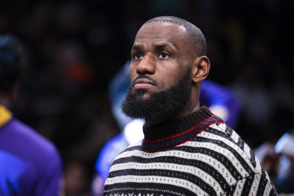 Los Angeles Lakers forward LeBron James (6) looks on from the bench during the first half of an NBA basketball game against the Brooklyn Nets, Monday, Jan. 30, 2023, in New York. (AP Photo/Corey Sipkin)