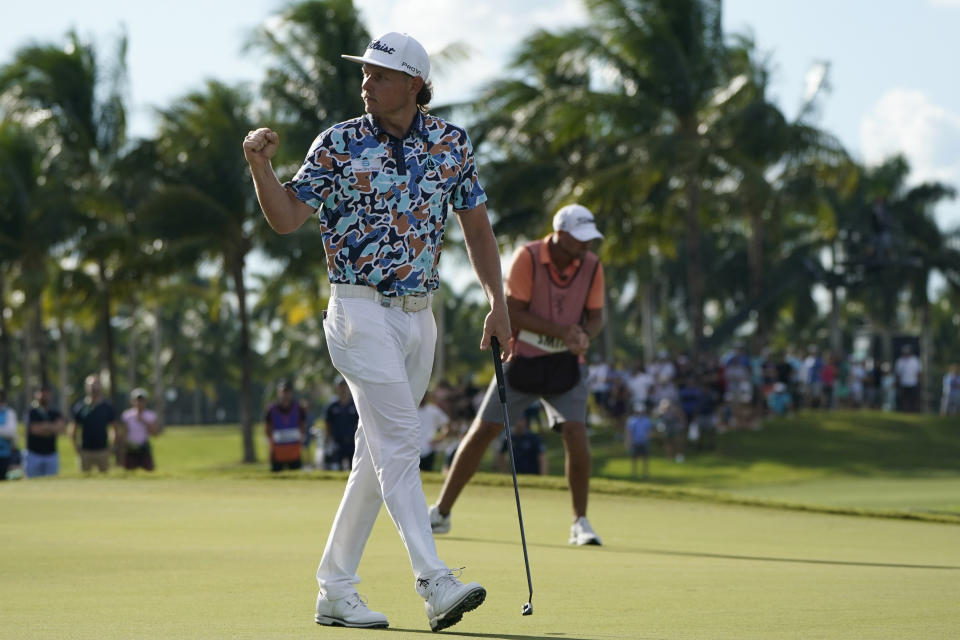 Cameron Smith pumps his fist after a birdie putt against Phil Mickelson on the eighth hole during the first round of the LIV Golf Team Championship at Trump National Doral Golf Club, Friday, Oct. 28, 2022, in Doral, Fla. (AP Photo/Lynne Sladky)