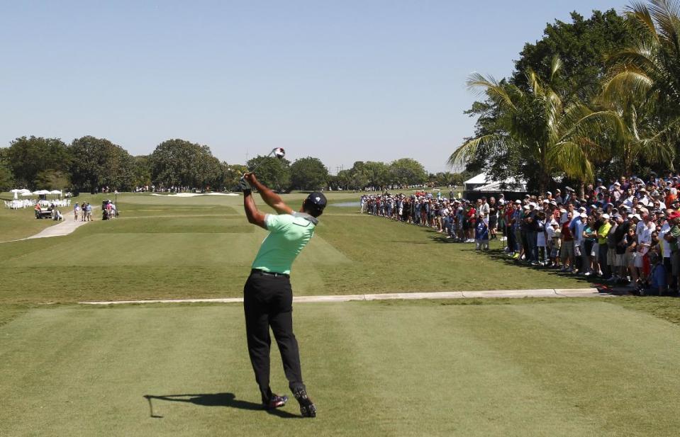 Tiger Woods hits from the third tee during the third round of the Cadillac Championship golf tournament Saturday, March 8, 2014, in Doral, Fla. (AP Photo/Wilfredo Lee)