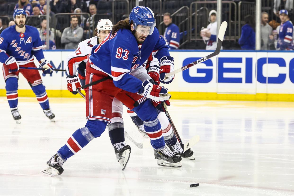 Apr 21, 2024; New York, New York, USA; New York Rangers center Mika Zibanejad (93) chases the puck in the second period against the Washington Capitals in game one of the first round of the 2024 Stanley Cup Playoffs at Madison Square Garden. Mandatory Credit: Wendell Cruz-USA TODAY Sports