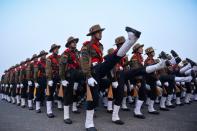 <p>Indian soldiers of the Assam Rifles march during a rehearsal for the forthcoming Republic Day parade on a foggy winter morning at Rajpath in New Delhi on January 4, 2016. India will celebrate its 67th Republic Day on January 26 with a large military parade. </p>