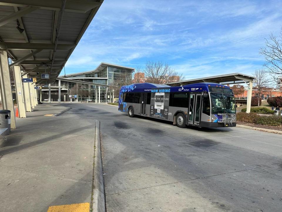 A GoDurham bus pulls out of Durham Station on Dec. 8, 2023, with a big “Now Hiring” sign on the side. The agency has been able to fill vacant driver positions and restore service to pre-pandemic levels starting Jan. 27, 2024.
