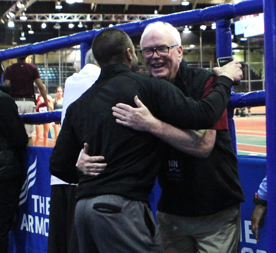 Former Pearl River coach Dan Doherty (r) hugs North Rockland coach Orlando Rivera after Rivera's boys 4x200 team won the Nike Indoor Nationals championship March 9, 2024 at The Armory.