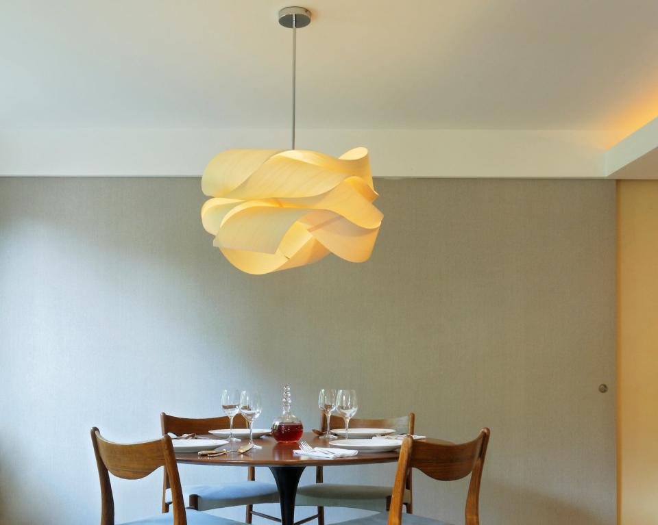 A large light fixture above a dining table