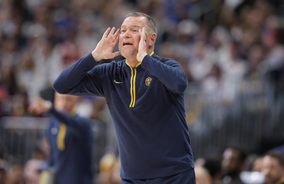 Denver Nuggets head coach Michael Malone directs his team against the Phoenix Suns in the first half of Game 5 of an NBA basketball Western Conference semifinal series Tuesday, May 9, 2023, in Denver. (AP Photo/David Zalubowski)