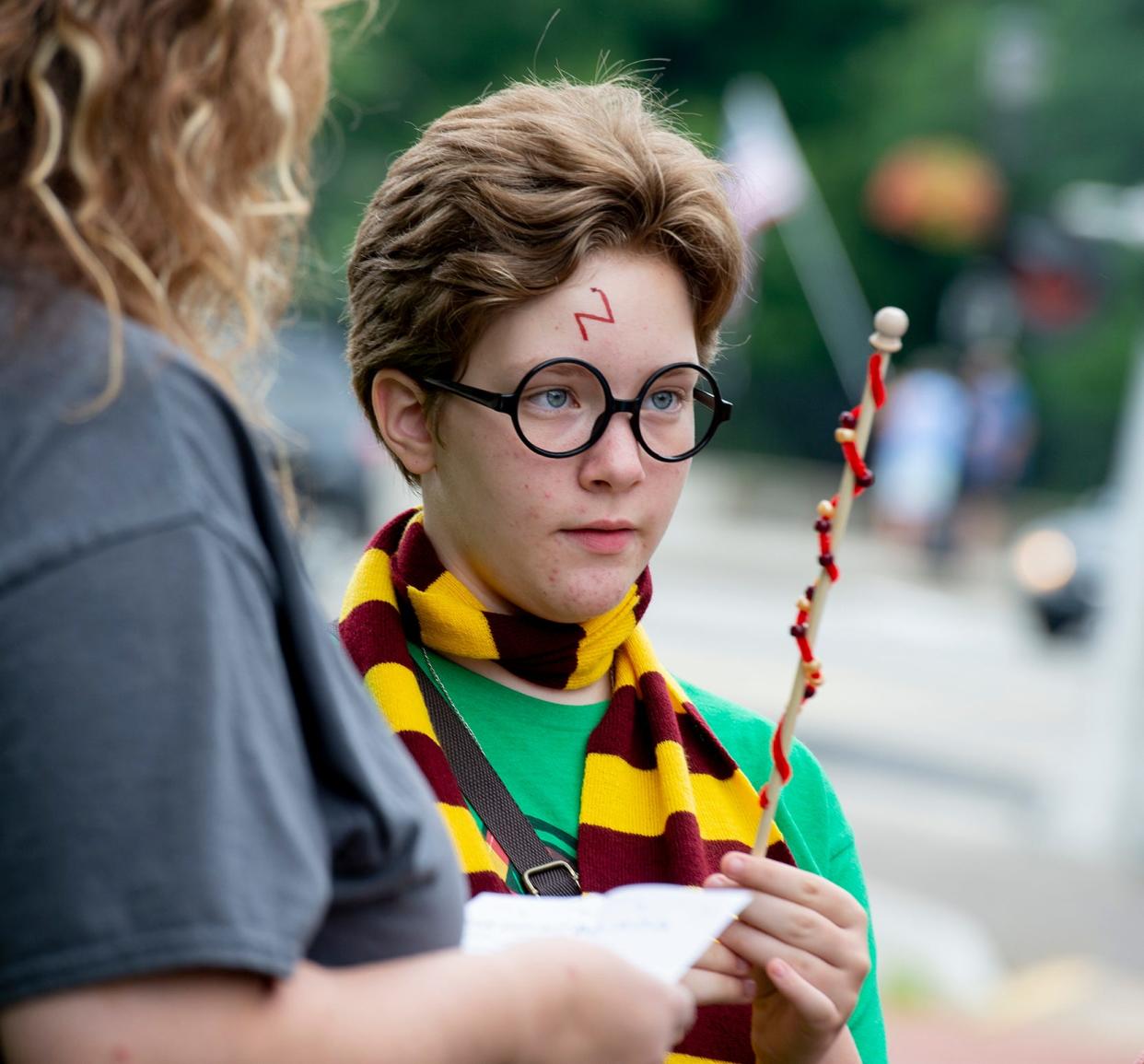 Jocelyn Zamberlan, 12, of Bradford Pennsylvania, eyes her wand at the 2021 Wizardly Weekend in Kent. A wand making workshop will be part of the festivities on Saturday.