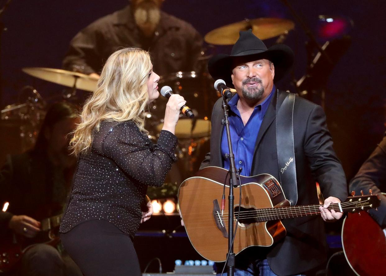 Trisha Yearwood, left, and Garth Brooks perform at Loretta Lynn's 87th Birthday Tribute at Bridgestone Arena on Monday, April 1, 2019, in Nashville, Tenn. (Photo by Al Wagner/Invision/AP)