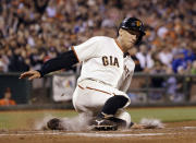 San Francisco Giants' Hunter Pence scores on single by Buster Posey during the third inning of a baseball game against the Los Angles Dodgers on Wednesday, April 16, 2014, in San Francisco. (AP Photo/Marcio Jose Sanchez)