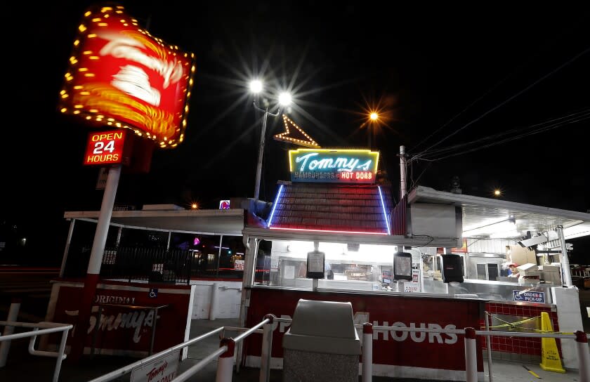 LOS ANGELES, CALIF. - APR. 4, 2020. The original Tommy's Hamburgers stand west of downtown Los Angeles remains open by serving takeout and delivery orders even as most restaurants have closed to help curb the spread of coronavirus. (Luis Sinco/Los Angeles Times)