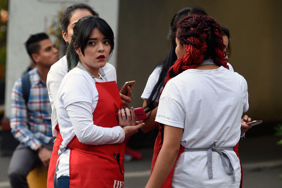 <p>Women stand in the street during a powerful earthquake in Mexico City on Feb. 16, 2018. (Photo: Alfredo Estrella/AFP/Getty Images) </p>