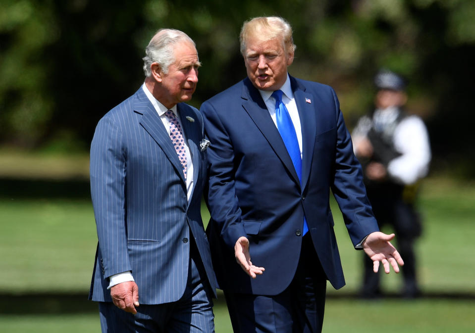 US President Donald Trump (R) walks with Britain's Prince Charles, Prince of Wales (L) as he arrives for a welcome ceremony at Buckingham Palace in central London on June 3, 2019, on the first day of the US president and First Lady's three-day State Visit to the UK. - Britain rolled out the red carpet for US President Donald Trump on June 3 as he arrived in Britain for a state visit already overshadowed by his outspoken remarks on Brexit. (Photo by TOBY MELVILLE / POOL / AFP)        (Photo credit should read TOBY MELVILLE/AFP/Getty Images)