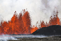 A volcano spews lava in Grindavik, Iceland, Wednesday, May 29, 2024. A volcano in southwestern Iceland is erupting, spewing red streams of lava in its latest display of nature's power. A series of earthquakes before the eruption Wednesday triggered the evacuation of the popular Blue Lagoon geothermal spa. The eruption began in the early afternoon north of Grindavik, a coastal town of 3,800 people that was also evacuated. (AP Photo/Marco di Marco)