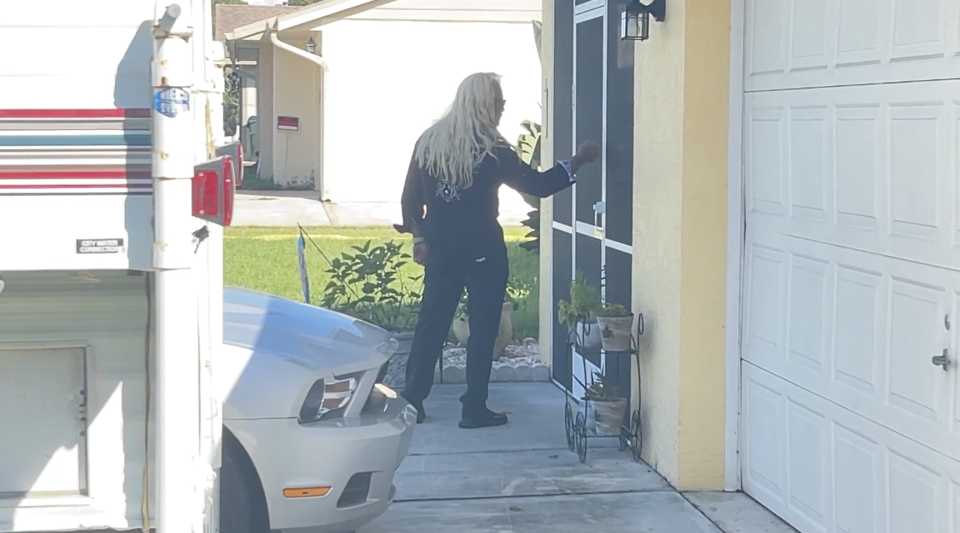 Dog the Bounty Hunter knocks on a door at the Laundrie residence.