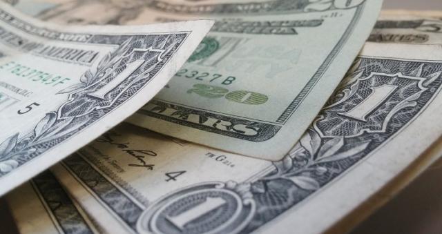 Closeup Of Fifty Dollar Bills On Wooden Table. Fifty Dollar Stock