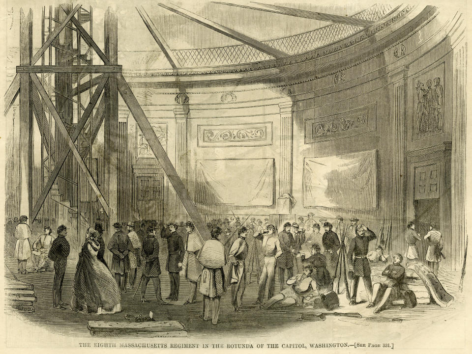 This illustration in the May 25, 1861 issue of Harper's Weekly depicts the Eighth Massachusetts Regiment with some civilians, and mattresses on the floor in the rotunda of the Capitol in Washington. To most Americans, the sight of armed National Guard troops sleeping in the Capitol Rotunda this past week was shocking and disturbing. But it also was an echo of the far-distant past — the Capitol was used as a bivouac for troops during the Civil War. (Harper's Weekly/Wilson's Creek National Battlefield via AP)