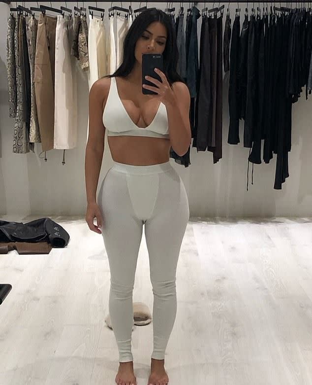 Kim Kardashian takes a selfie in a bra and leggings