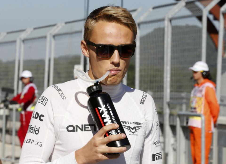 Marussia Formula One driver Chilton drinks during the first practice session of the Korean F1 Grand Prix at the Korea International Circuit in Yeongam