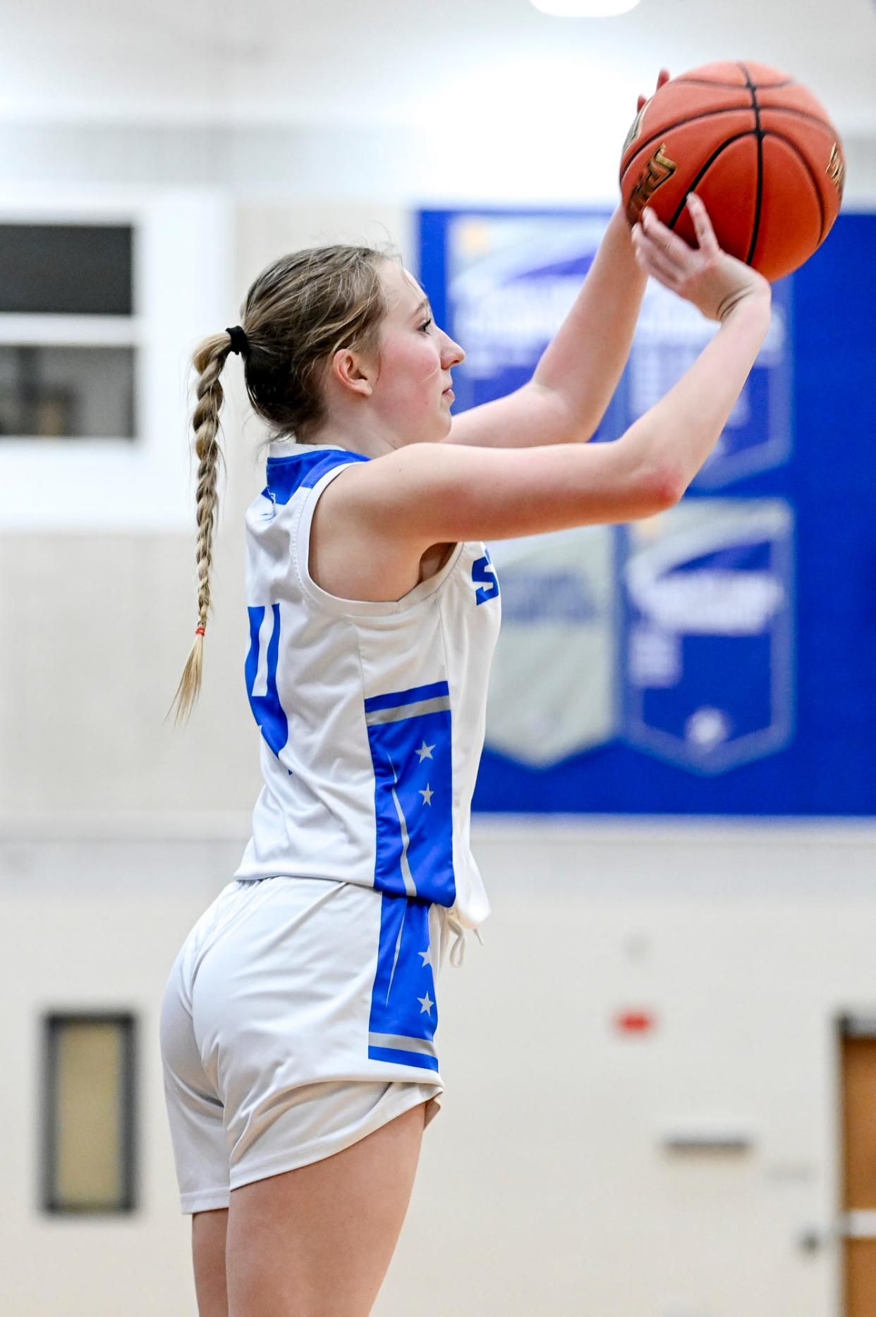 Lansing Community College's Bailey Hosford makes a 3-pointer against Mid Michigan College during the fourth quarter on Tuesday, Dec. 19, 2023, in Lansing.