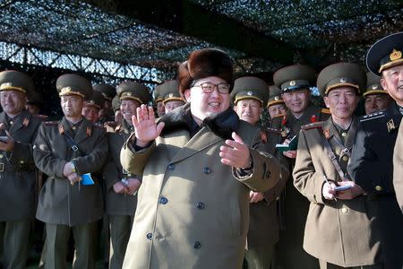 North Korean leader Kim Jong Un smiles while watching the Korean People's Army (KPA) tank crews' competition at an unknown location, in this undated photo released by North Korea's Korean Central News Agency (KCNA) in Pyongyang on March 11, 2016. REUTERS/KCNA