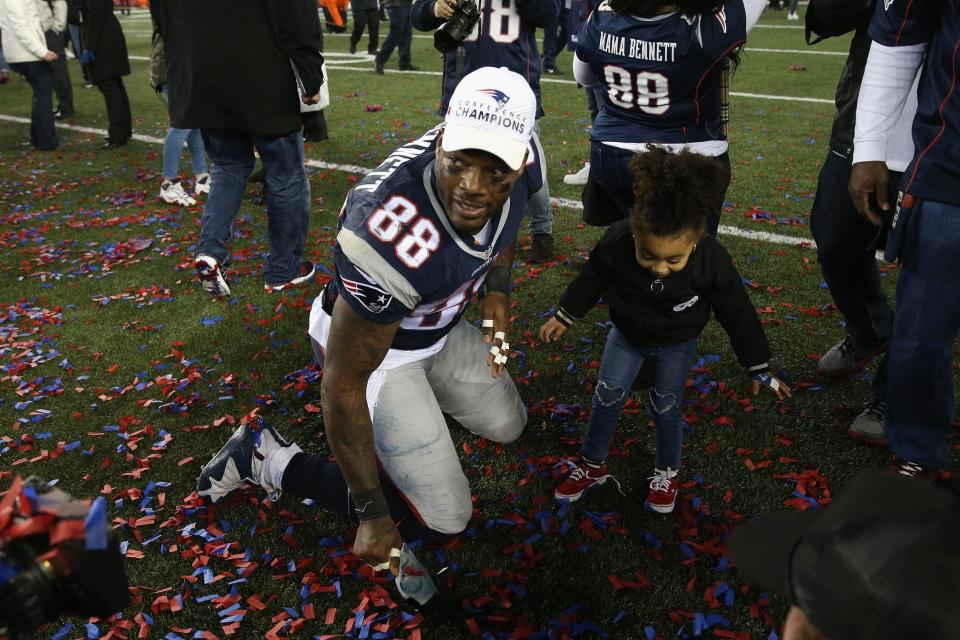 <p>Martellus Bennett #88 of the New England Patriots celebrates with family members after defeating the Pittsburgh Steelers 36-17 to win the AFC Championship Game at Gillette Stadium on January 22, 2017 in Foxboro, Massachusetts. (Photo by Patrick Smith/Getty Images) </p>