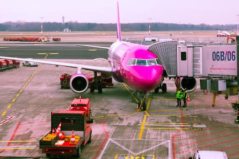 Wizz Air was one of the first airlines to charge for hand luggage - Credit: GETTY