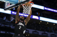 Los Angeles Clippers forward Kawhi Leonard dunks against the Charlotte Hornets during the first half of an NBA basketball game in Charlotte, N.C., Sunday, March 31, 2024. (AP Photo/Nell Redmond)