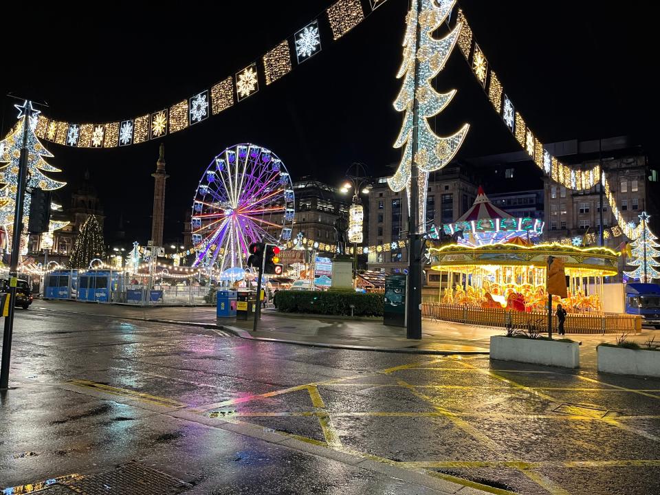 A Christmas market at night in Glasgow, Scotland.