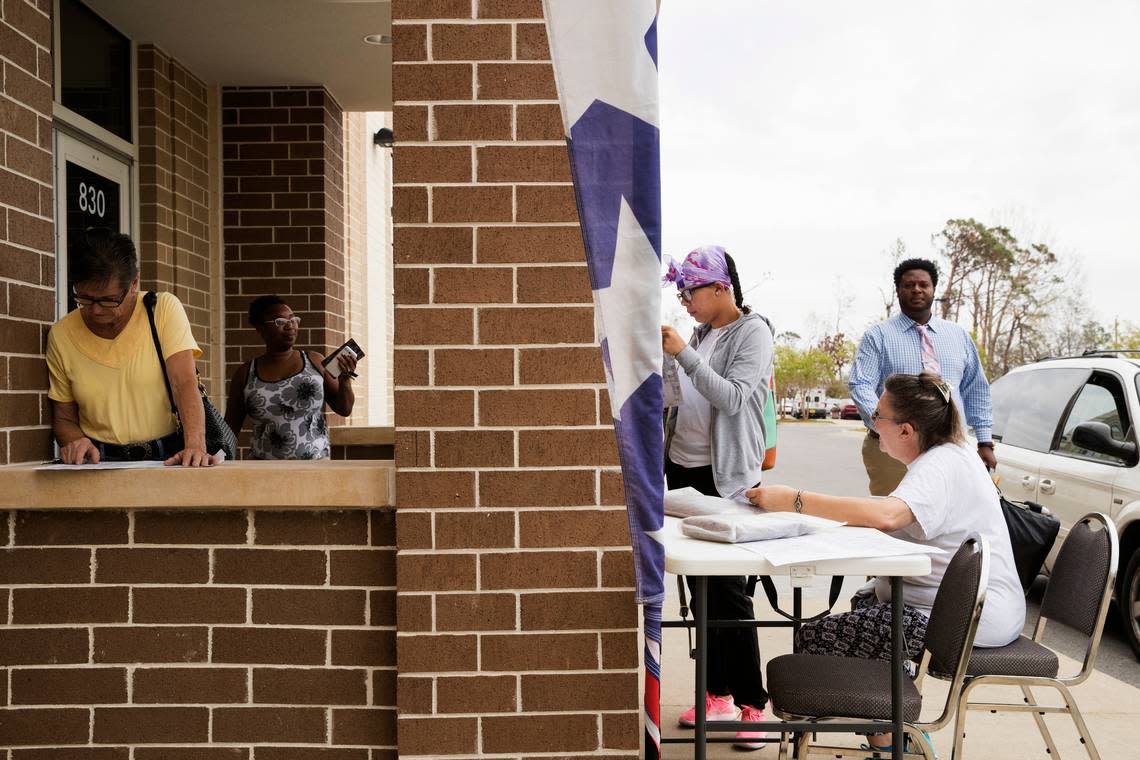 Voters enter the supervisor of elections office mega-voting site in Panama City on Tuesday, Nov. 6, 2018.