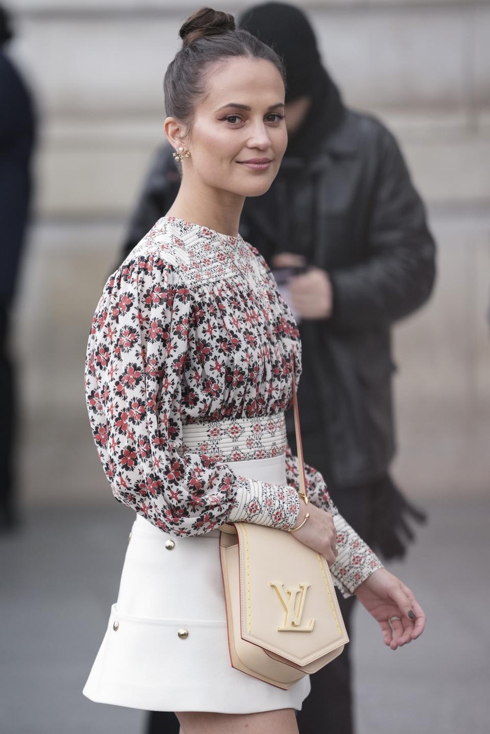 Alicia Vikander arrives for the Louis Vuitton Fall/Winter 2023-2024 ready-to-wear collection presented Monday, March 6, 2023 in Paris. (Scott Garfitt/Invision/AP)