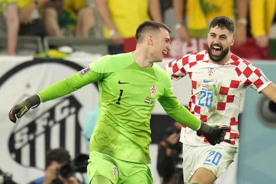 Croatia's goalkeeper Dominik Livakovic celebrates his team victory over Brazil after the penalty shootout in the World Cup quarterfinal soccer match between Croatia and Brazil, at the Education City Stadium in Al Rayyan, Qatar, Friday, Dec. 9, 2022. (AP Photo/Andre Penner)
