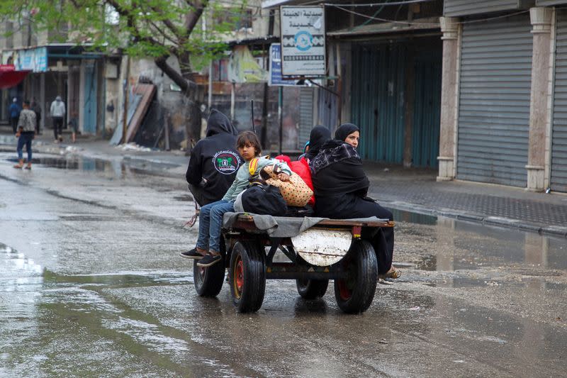 People flee the eastern parts of Rafah after the Israeli military began evacuating Palestinian civilians ahead of a threatened assault on the southern Gazan city