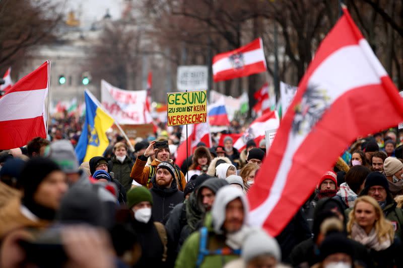 Thousands of people march to protest against restrictions on public life to curb the coronavirus pandemic