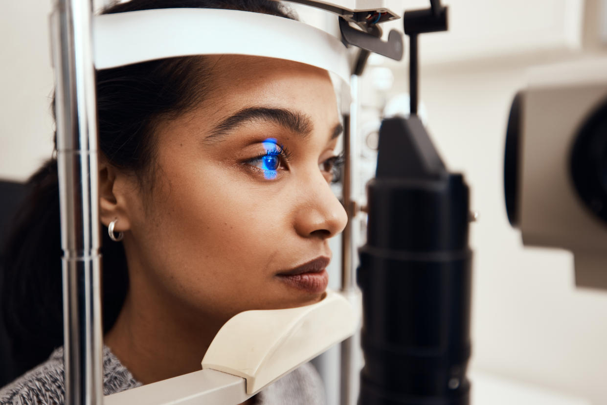 A young woman having an eye scan. (Getty Images)