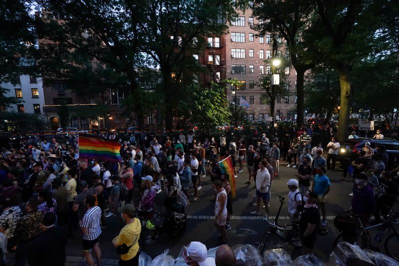 People attend a rally at the Stonewall Inn to support the Supreme Court decision to uphold LBGTQ+ workplace rights in New York