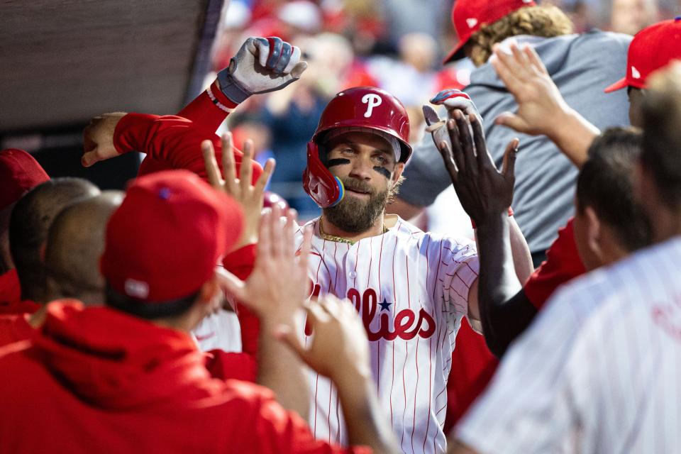 Philadelphia Phillies first base Bryce Harper celebrates in the dugout after hitting a grand slam during the fourth inning against the Toronto Blue Jays Tuesday, May 7, 2024, at Citizens Bank Park.