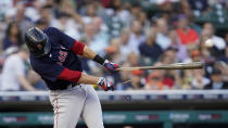 Boston Red Sox's J.D. Martinez hits a broken bat single against the Detroit Tigers in the third inning of a baseball game in Detroit, Tuesday, Aug. 3, 2021. (AP Photo/Paul Sancya)