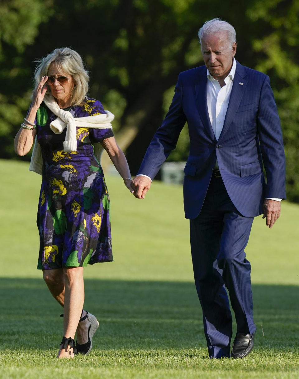 President Joe Biden and first lady Jill Biden walk on the South Lawn of the White House after stepping off Marine One, Sunday, June 27, 2021. - Credit: AP