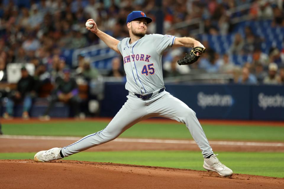 New York Mets starting pitcher Christian Scott (45) throws a pitch against the Tampa Bay Rays during the first inning on May 4, 2024, at Tropicana Field.