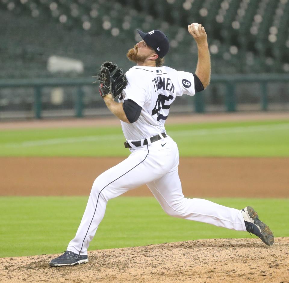 Tigers pitcher Buck Farmer pitches against the Reds during the eighth inning of the Tigers' 7-2 win at Comerica Park on Friday, July 31, 2020.