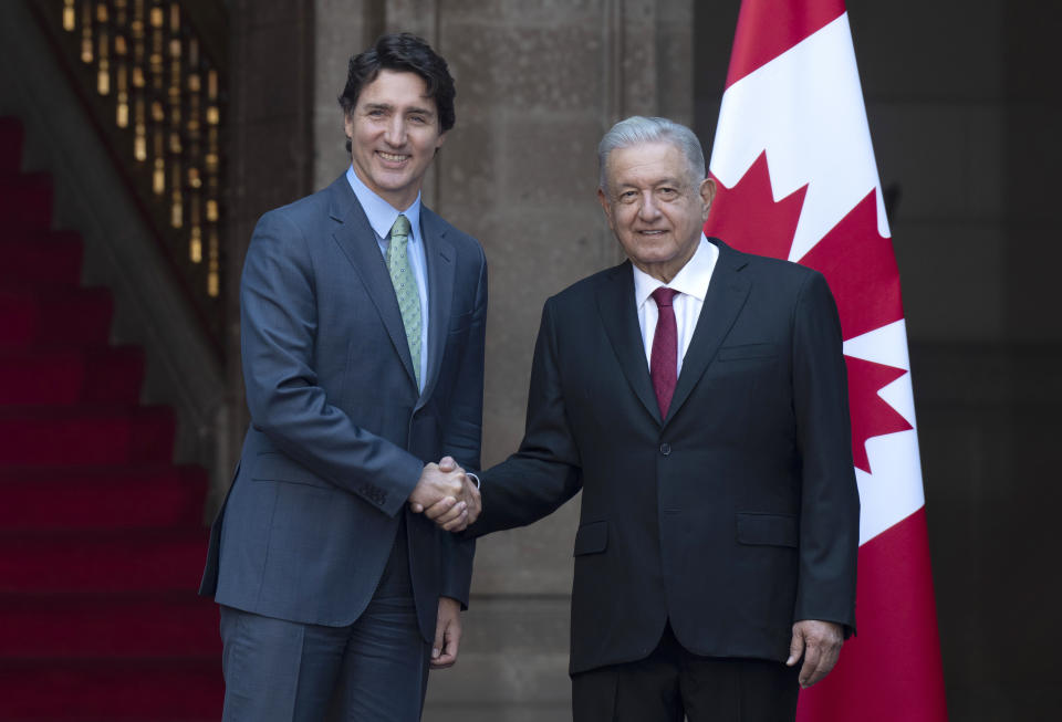 Canadian Prime Minister Justin Trudeau, left, shakes hands with Mexican President Andres Manuel Lopez Obrador as he arrives at the National Palace in Mexico City, Mexico, Wednesday Jan. 11, 2023. (Adrian Wyld/The Canadian Press via AP)