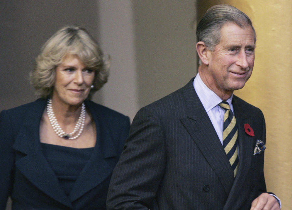 Britain's Prince Charles and his wife Camilla, Duchess of Cornwall, arrive at the National Building Museum, Thursday, Nov. 3, 2005, in Washington. Britain's queen consort, Camilla, has come a long way. On May 6, she will be crowned alongside her husband and officially take her first turns on the world stage as Queen Camilla. It’s been a remarkable and painstakingly slow transformation over five decades. Camilla was long reviled as the other woman in Charles' marriage to Diana and considered a liability to the British monarchy. (AP Photo/Manuel Balce Ceneta, File)